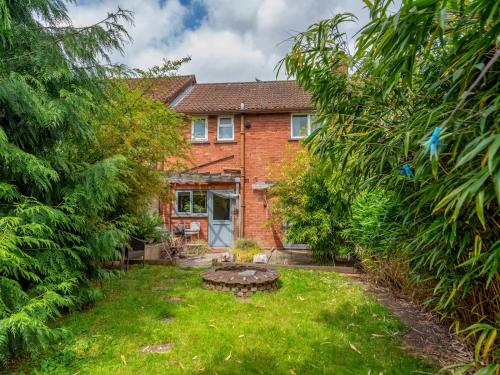 a brick house with a garden in front of it at Pass the Keys Cosy Spacious Garden House in Bridgnorth