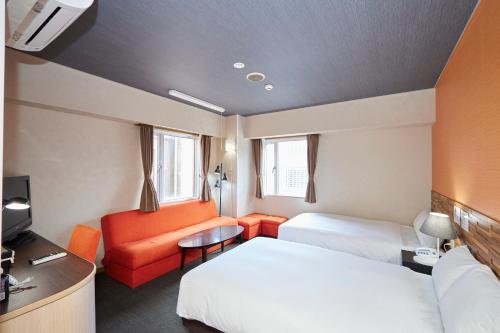 Smile Hotel Miyakojimaにあるベッド