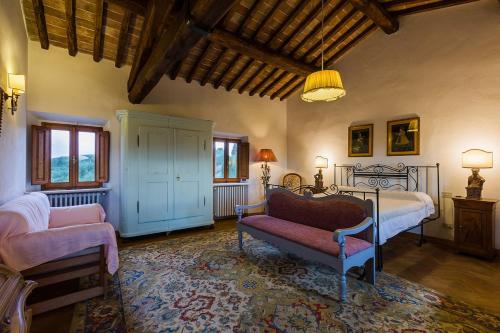 a living room with two beds and a couch at Florence Countryside Giogoli a place to be in Scandicci
