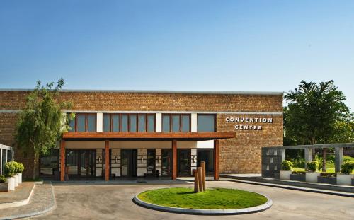 a brick building with a sign that reads convention center at The Golkonda Resort and Spa in Hyderabad