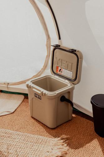 a scale sitting on top of a bucket in a room at Bamburgh Under Canvas in Bamburgh