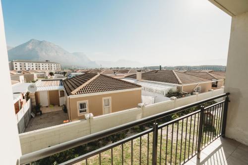 a view from the balcony of a house at Muizi Hideaway in Muizenberg