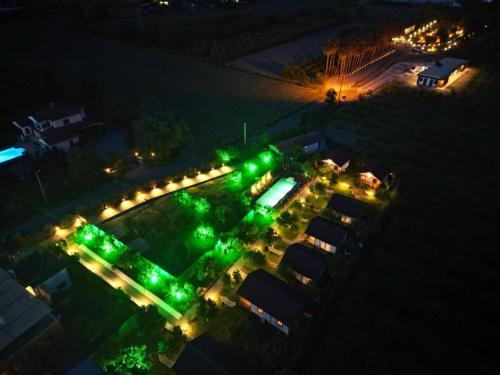an overhead view of a parking lot with green lights at İztuzu Bungalow & Camping in Ortaca