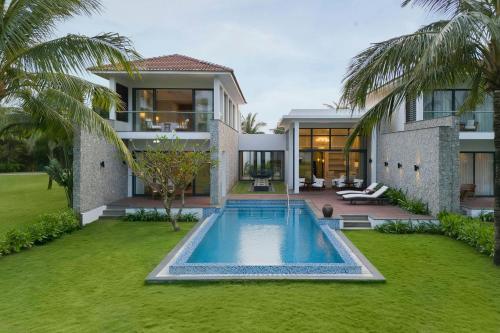 an image of a house with a swimming pool at Renaissance Danang Hoi An Resort & Spa in Hoi An