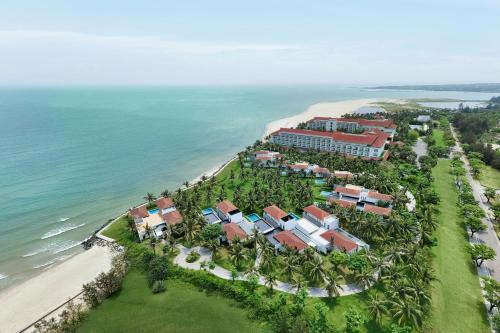 an aerial view of a resort next to the ocean at Renaissance Danang Hoi An Resort & Spa in Hoi An