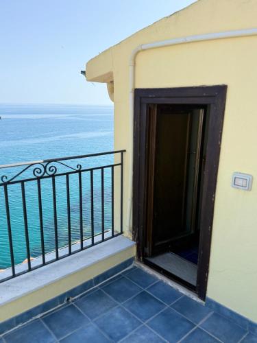 a balcony with a view of the ocean at MiraMare Residence Cefalú in Cefalù
