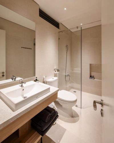 a bathroom with a sink and a toilet and a shower at Express by M Village Nguyễn Bỉnh Khiêm in Ho Chi Minh City