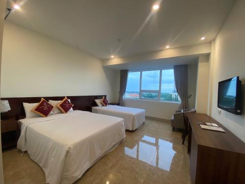 Postel nebo postele na pokoji v ubytování SÀI GÒN - BẠC LIÊU Hotel