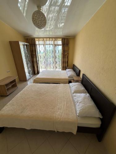 Postel nebo postele na pokoji v ubytování GRANAT Hotel
