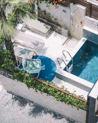 an outdoor swimming pool with a pool noodle at Padam Hotel & SPA in Ulcinj