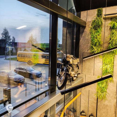 a motorcycle on display in a window of a building at SCANDINAVIA House - dom z jacuzzi in Zator