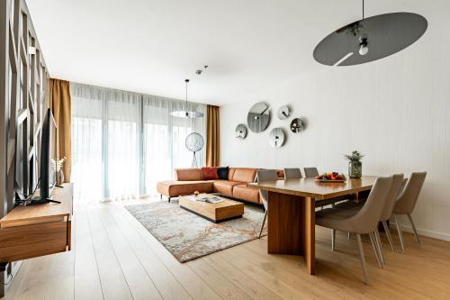 a living room with a couch and a table at Emerald Downtown Luxury Suites by Continental Group in Budapest
