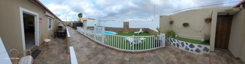a balcony of a building with a swimming pool at apartamento 1 tenerife sur in Arona