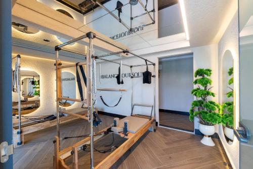 a room with a gym with plants on the wall at Rusel Park Residence in Bahcesehir