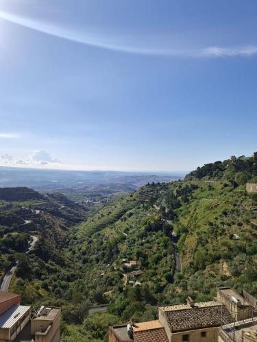 a view of a hill with the ocean in the background at Casa Talìa in Centuripe