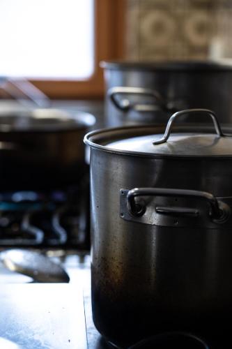 a group of pots sitting on top of a stove at Gasthof Schöntal in Werfenweng