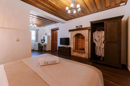 Uma TV ou centro de entretenimento em Zacosta Villa Hotel