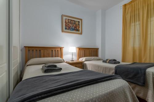 Postel nebo postele na pokoji v ubytování Playa Canela I by Ĥ
