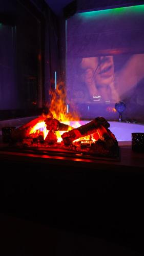 a fire oven with some food in it at PentLux - SPA Penthouse in the heart of Skopje in Skopje