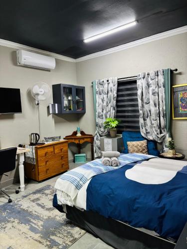 Postel nebo postele na pokoji v ubytování Calabash Executive Stay