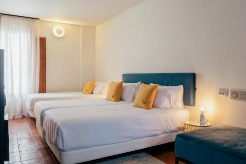 Postel nebo postele na pokoji v ubytování Hotel Cetina Palacio Ayala Berganza