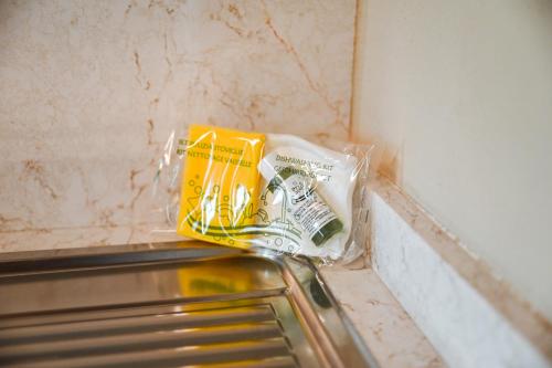 a corner of a refrigerator with a bag of food at Old Village Linda - Tra Lunigiana & Cinque Terre in Comano