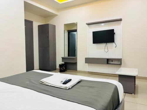Hotel Millennium Roomsにあるテレビまたはエンターテインメントセンター
