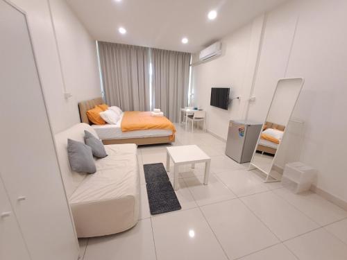 a living room with a bed and a mirror at Namasstay Silom in Chinatown