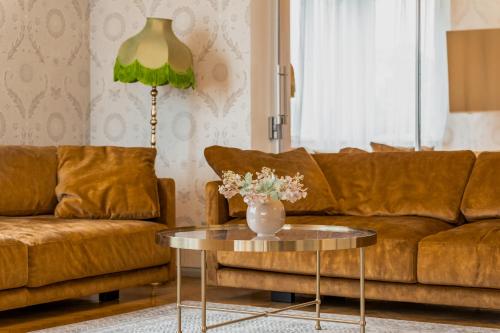 a living room with a couch and a table at Jakobsoni 1937 in Viljandi