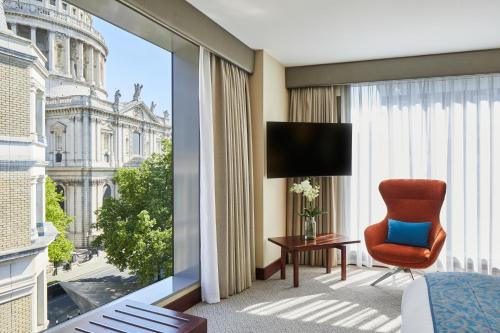 a hotel room with a view of the city at Leonardo Royal London St Paul’s in London