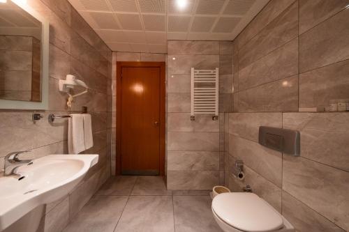a bathroom with a toilet and a sink at Iris Hotel & Spa in Canakkale