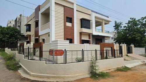 a building with a fence in front of it at Naidu Nilayam in Secunderabad