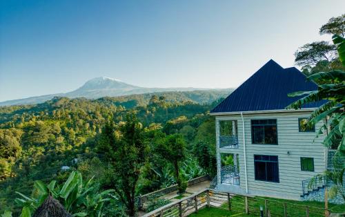 a house with a view of a mountain at Materuni Homes in Moshi