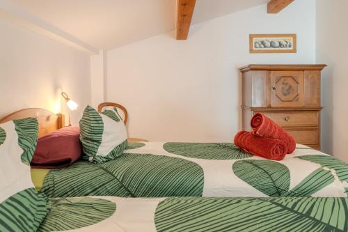 two beds sitting next to each other in a bedroom at Mas Vinyoles 2 in Montnegre