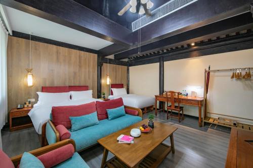 Ένα ή περισσότερα κρεβάτια σε δωμάτιο στο Hoya Hotel Hangzhou West Lake Lingyin Temple Branch