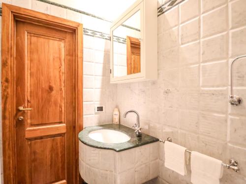 a bathroom with a sink and a mirror at Tuscan Nest - in Montecatini Alto in Montecatini Alto