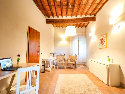 a living room with a table and a dining room at Tuscan Nest - in Montecatini Alto in Montecatini Alto
