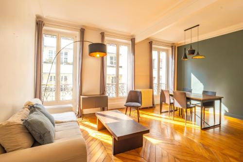 a living room with a couch and a table at 4 Guests Flat - Turbigo in Paris