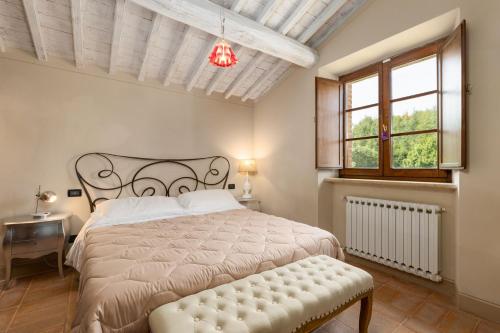 A bed or beds in a room at Villa San Michele by PosarelliVillas