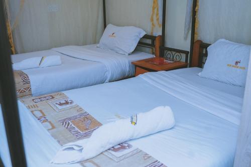 Postel nebo postele na pokoji v ubytování Lazarus Kaka Hotel Urbane