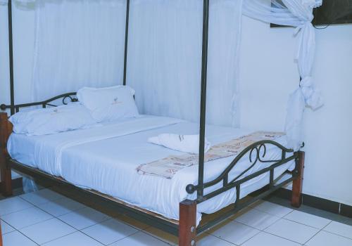 Postel nebo postele na pokoji v ubytování LAZARUS KAKA CBD Accomodations