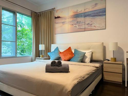 a bedroom with a large bed with two towels on it at Relaxing Link to beach with pool in Hua Hin