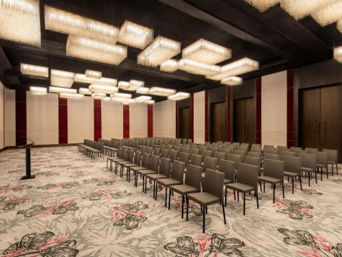 an empty room with chairs and a carpet at Fairmont Tazi Palace Tangier in Tangier