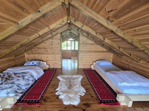 a room with two beds in a attic at CabinAtRiver Ada Bojana in Ulcinj