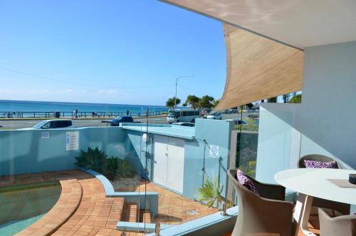 a view of the ocean from the balcony of a house at Alex Beach Apartment in Alexandra Headland