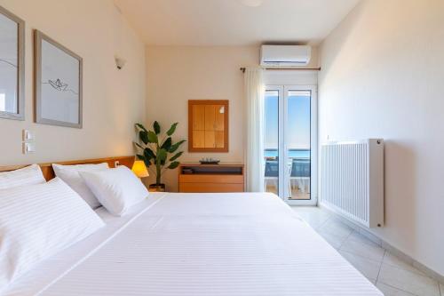 Postel nebo postele na pokoji v ubytování Sky & Sea Apartment