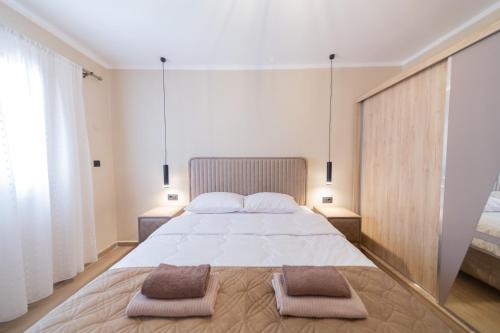 Postel nebo postele na pokoji v ubytování Villa Jana Lapčići