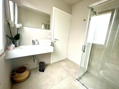 a bathroom with a sink and a shower at Villa Nina in Lagosanto