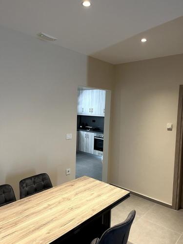 a conference room with a wooden table and chairs at The 52 Spot in Kos Town