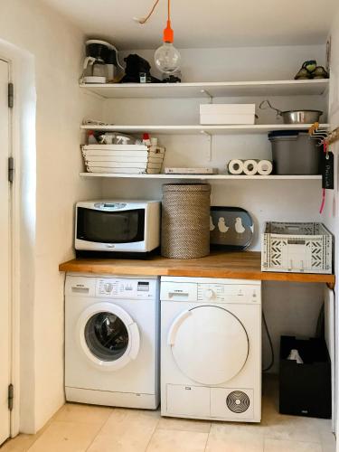a laundry room with a washer and dryer at Live In Classic Skagen House In Skagen's Heart in Skagen